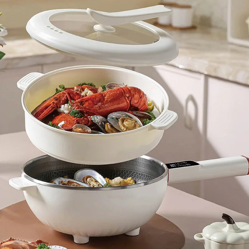 Electric cooking pot on base with clear lid, 4.5L inner bowl, steaming seafood dish