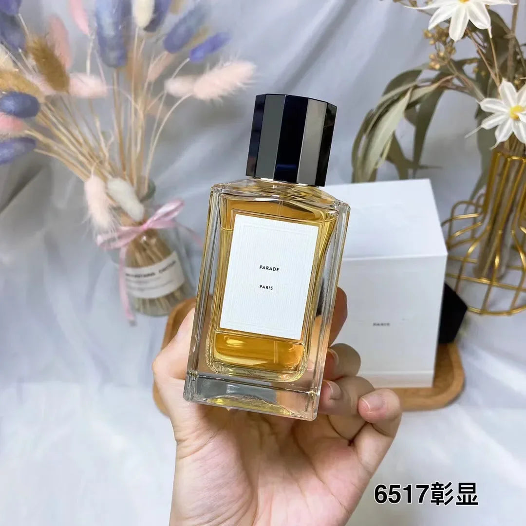 Parade Paris long-lasting unisex perfume in a rectangular glass bottle with black cap. Luxury fragrance spray.