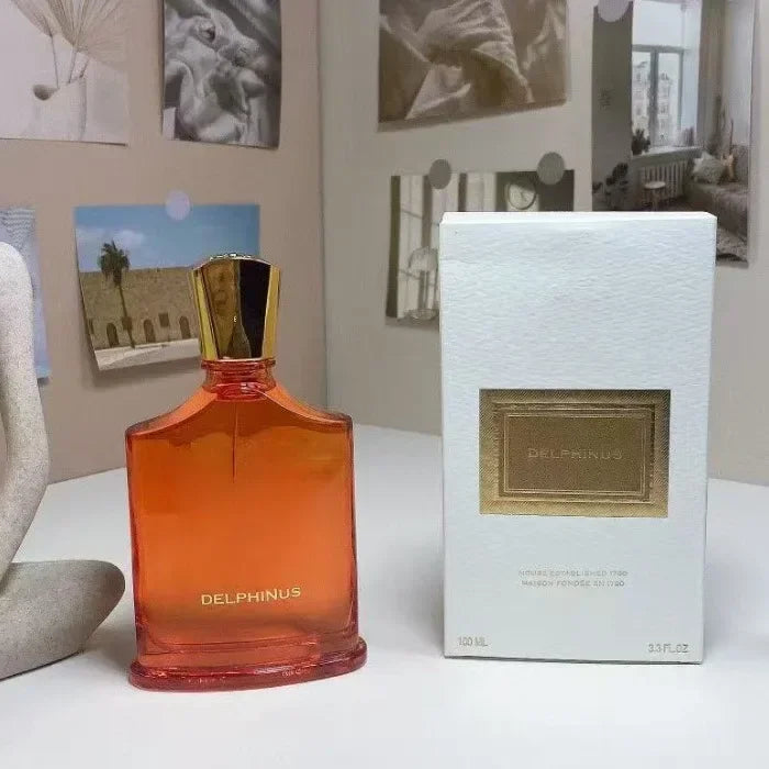 Delphinus 100ml orange glass bottle perfume. Luxury fruity floral unisex cologne with gold cap and white gift box.