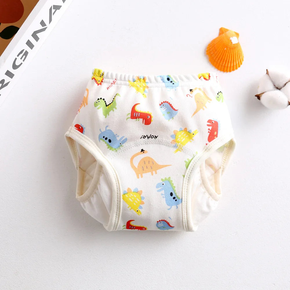 Toddler cloth training diaper with colorful dinosaur print for baby care.