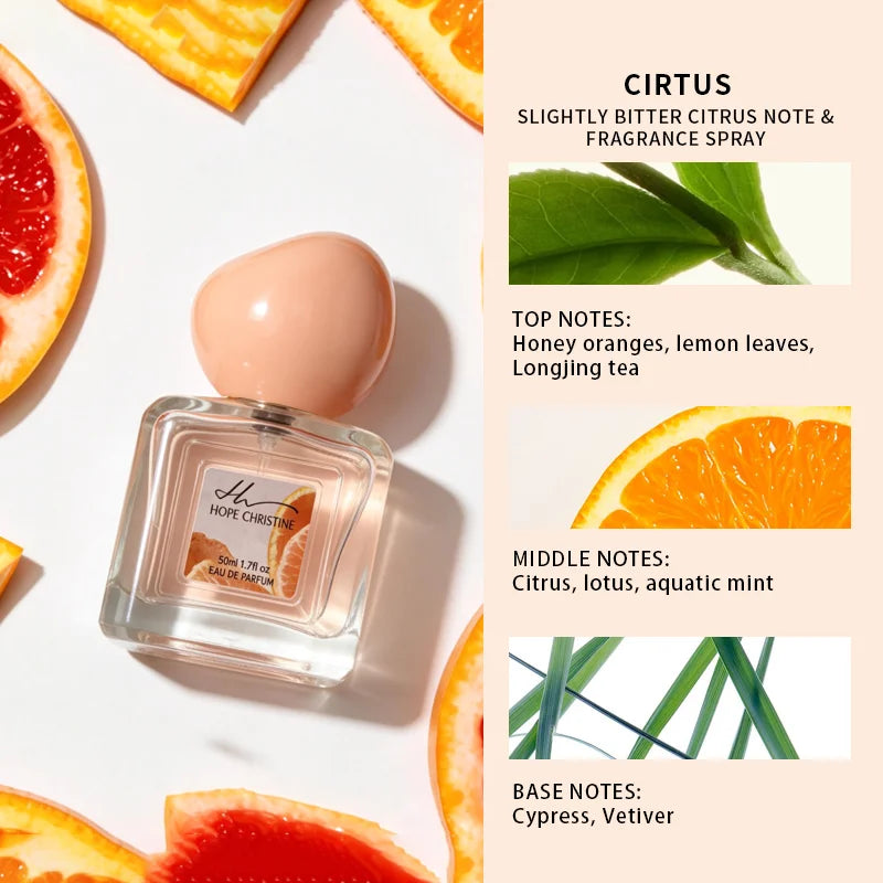 Hope Christine Cirtus 50ml perfume in a square glass bottle with a peach cap, surrounded by fresh citrus fruit slices.