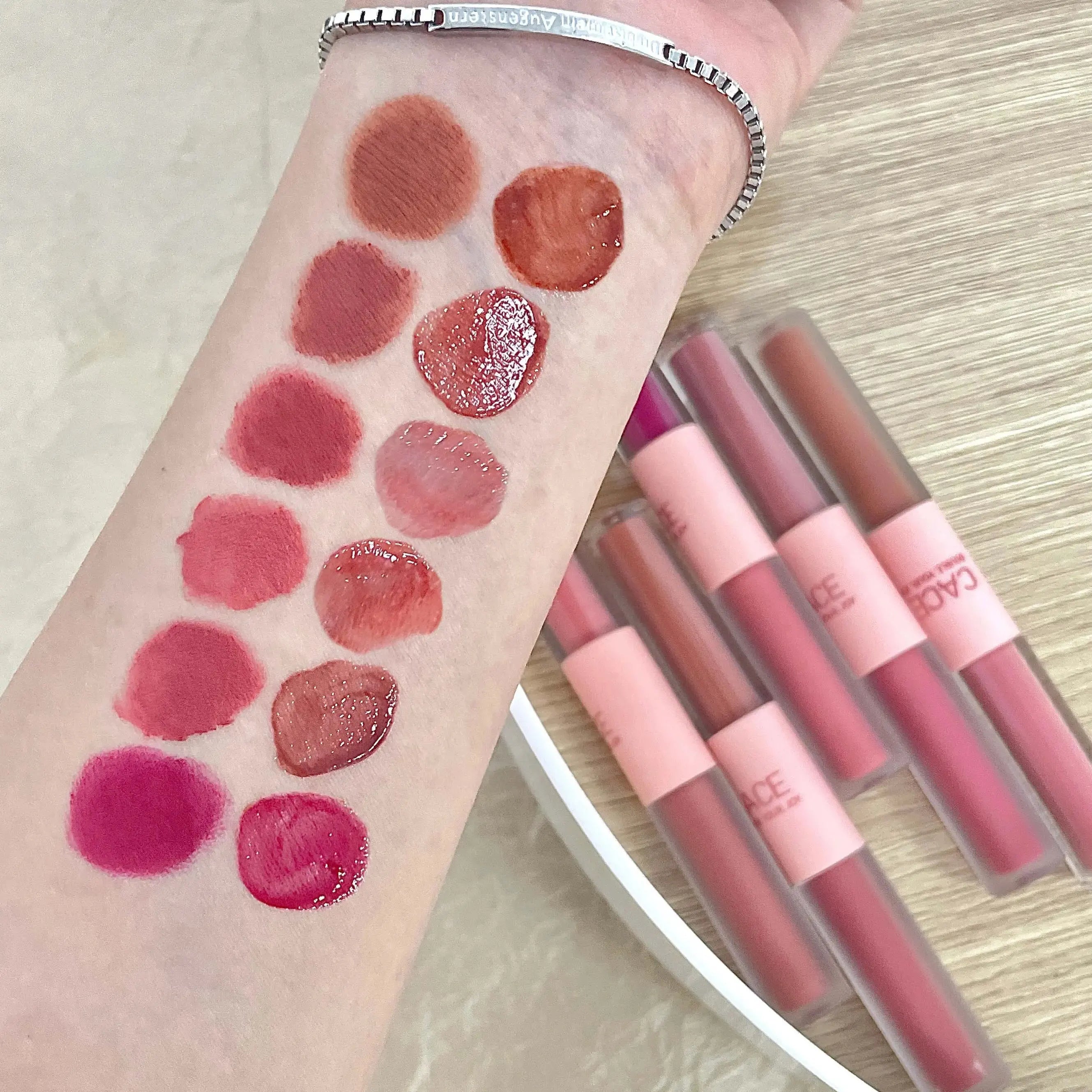 CACE double-head lip glaze swatches: matte lip mud and glossy mirror finish in various red and pink shades.