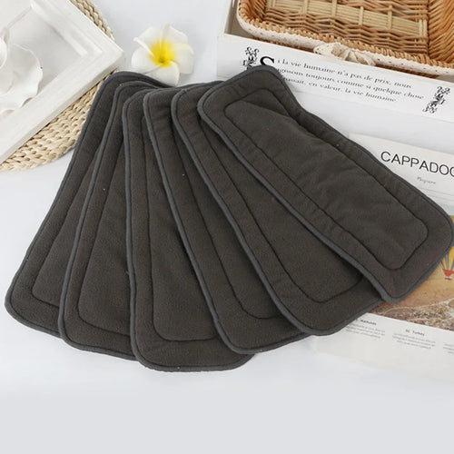 Set of 5 charcoal grey bamboo baby cloth diaper inserts for absorbent, reusable cloth diapering.