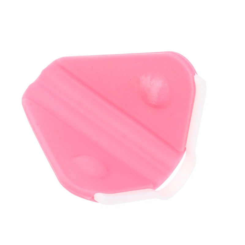 Pink plastic nose shaper clip for bridge lifting and facial correction beauty tool, isolated on white background.
