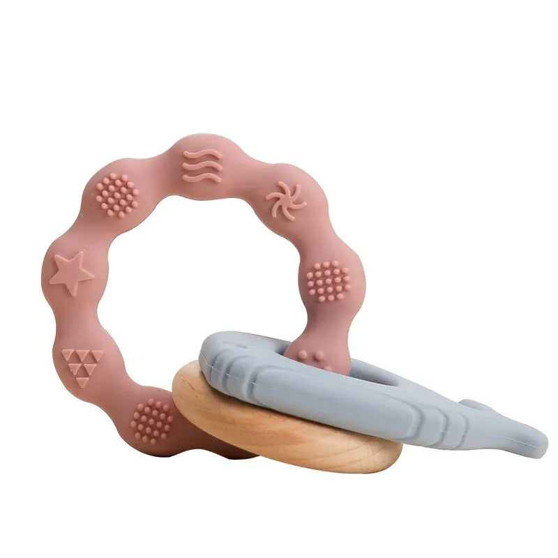 Pink and grey silicone teething ring with natural wood for baby teething relief.