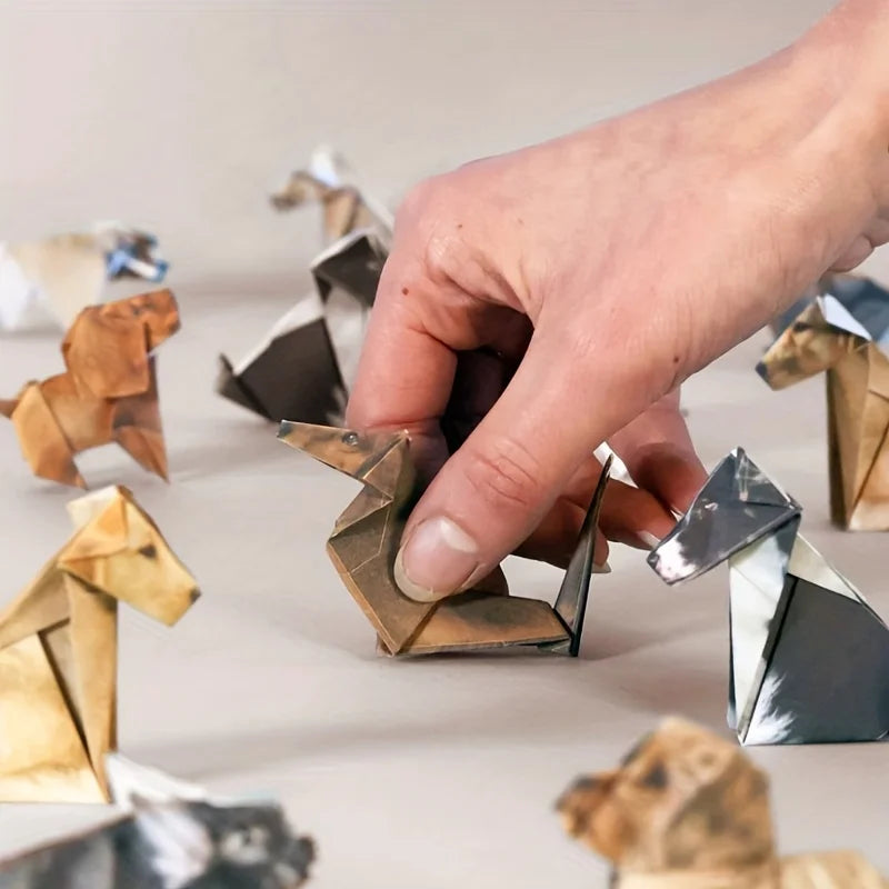 Hand folding a cute paper origami cat craft, a creative DIY gift for cat lovers and unique home decor.
