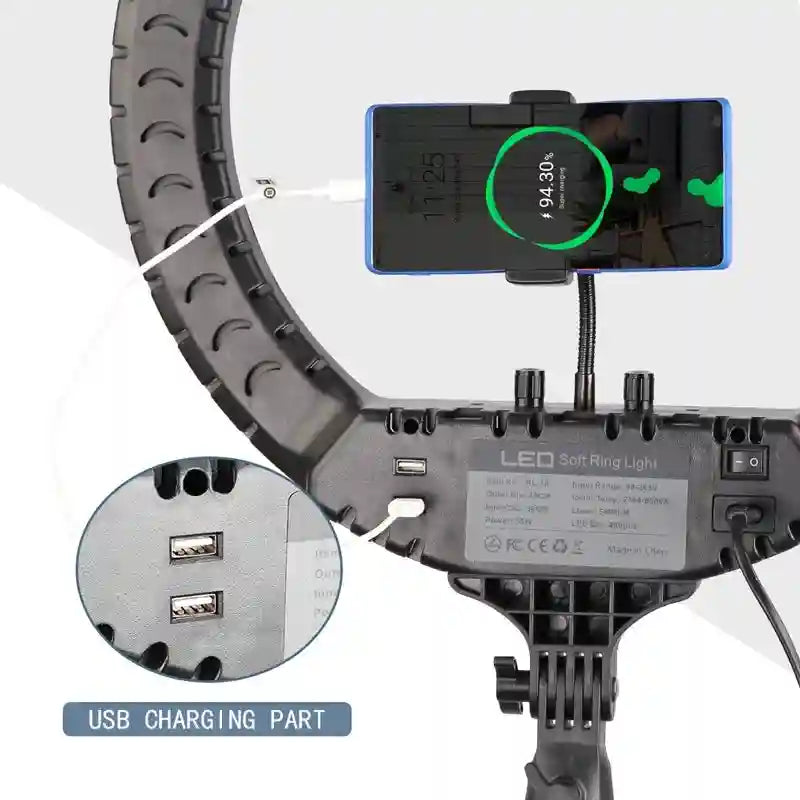Black LED ring light with phone holder, USB charging ports, and power cable for studio photography and live streaming.