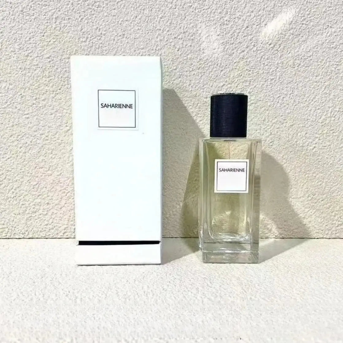 Saharienne unisex 125ml perfume: oriental woody, grapefruit, floral scent in a tall clear square glass bottle with cap.