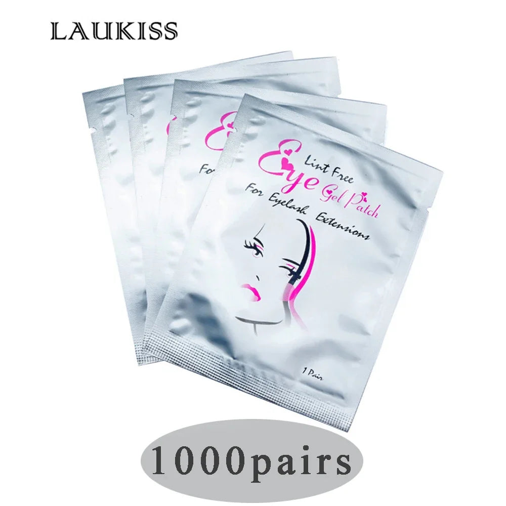 Silver foil packets of lint-free under-eye gel patches for eyelash extensions, featuring pink graphic branding.