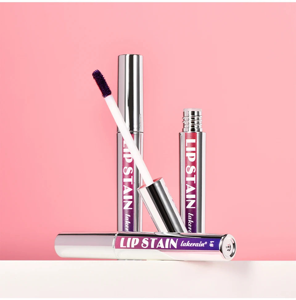 Lakerain waterproof peel-off lip stain with applicator, long-lasting matte finish in silver tubes on pink background.