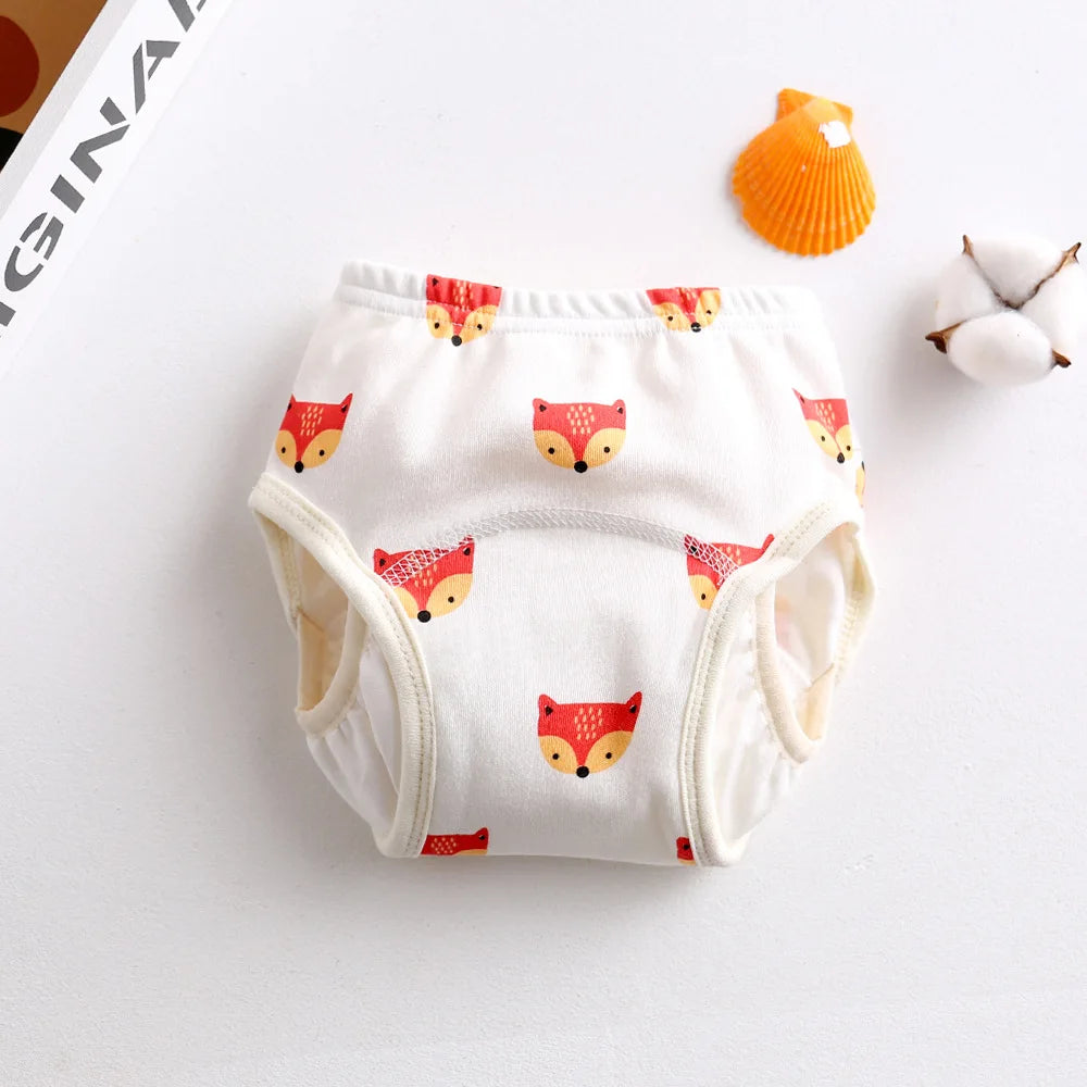 Baby training diaper with orange fox pattern, white cotton baby care absorbent underwear.
