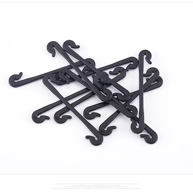 Assorted black plant lashing hook clips, multiple curved curved-ended pieces