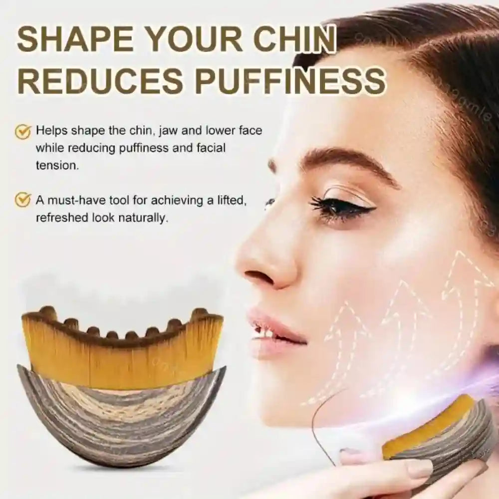 Curved facial massage brush with wood-grain handle and soft, dense bristles, shown in use on a woman's jawline.