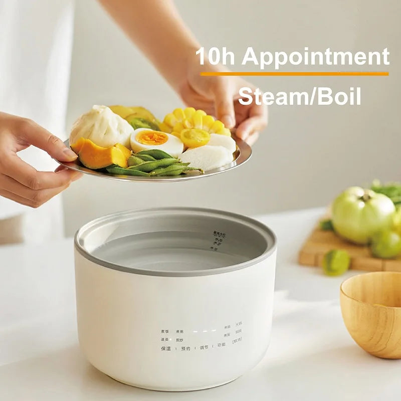 1.5L electric rice cooker on counter, steaming-ready inner pot with assorted vegetables