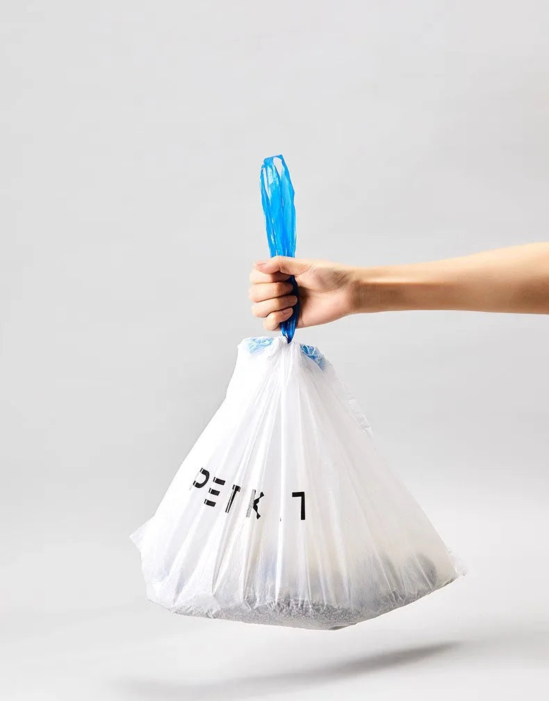 Hand holding a durable, white Petkit smart cat litter trash bag for easy, mess-free pet waste disposal.