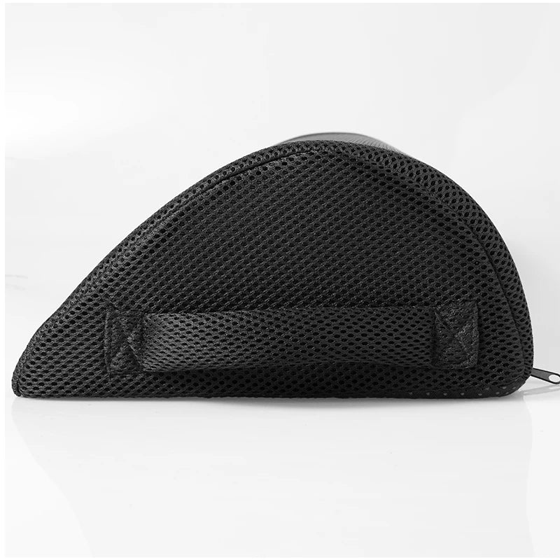 Black memory foam footstool with breathable mesh cover and carrying handle for improved office and gaming posture.