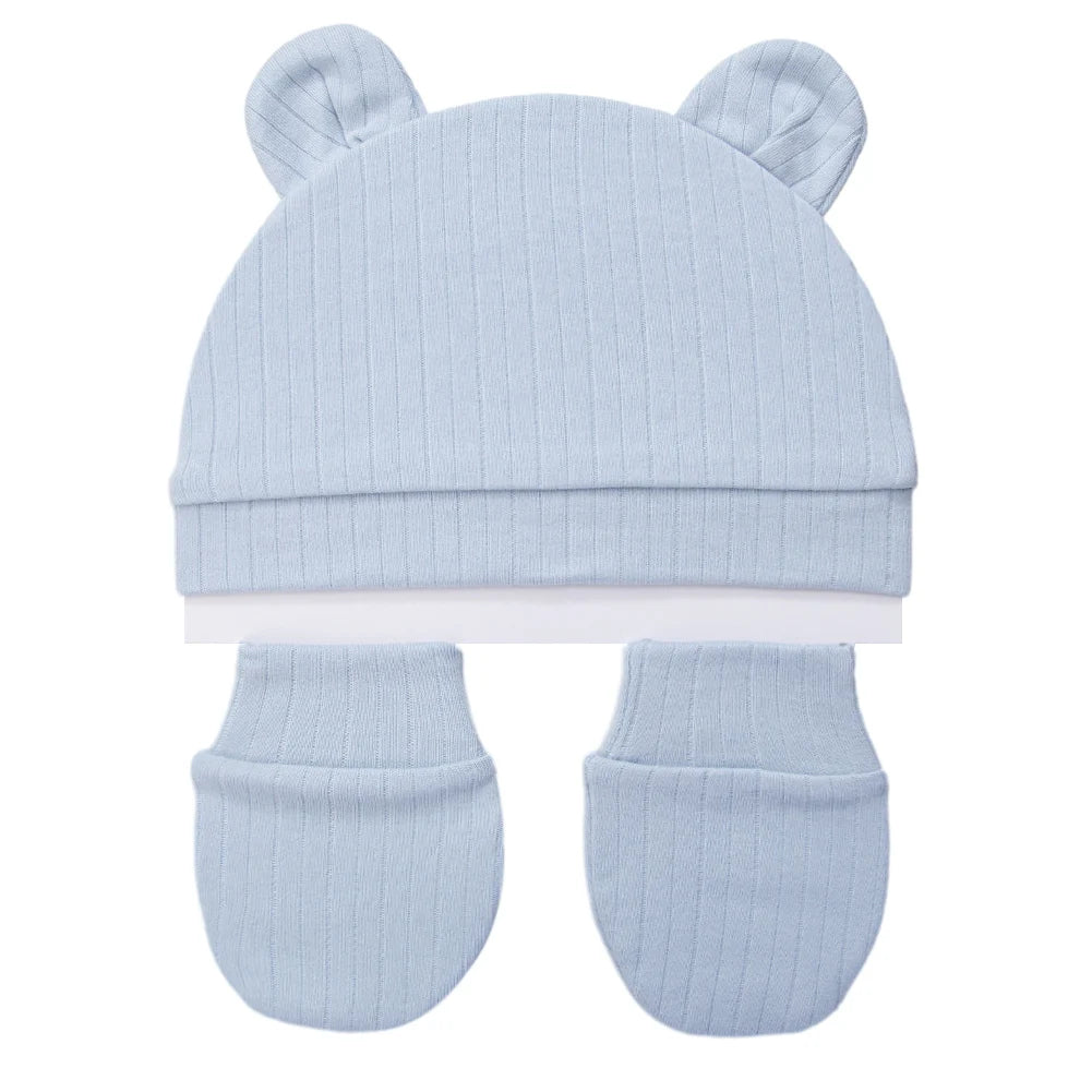 Light blue ribbed cotton newborn baby set including a bear ear beanie and two matching scratch mittens.