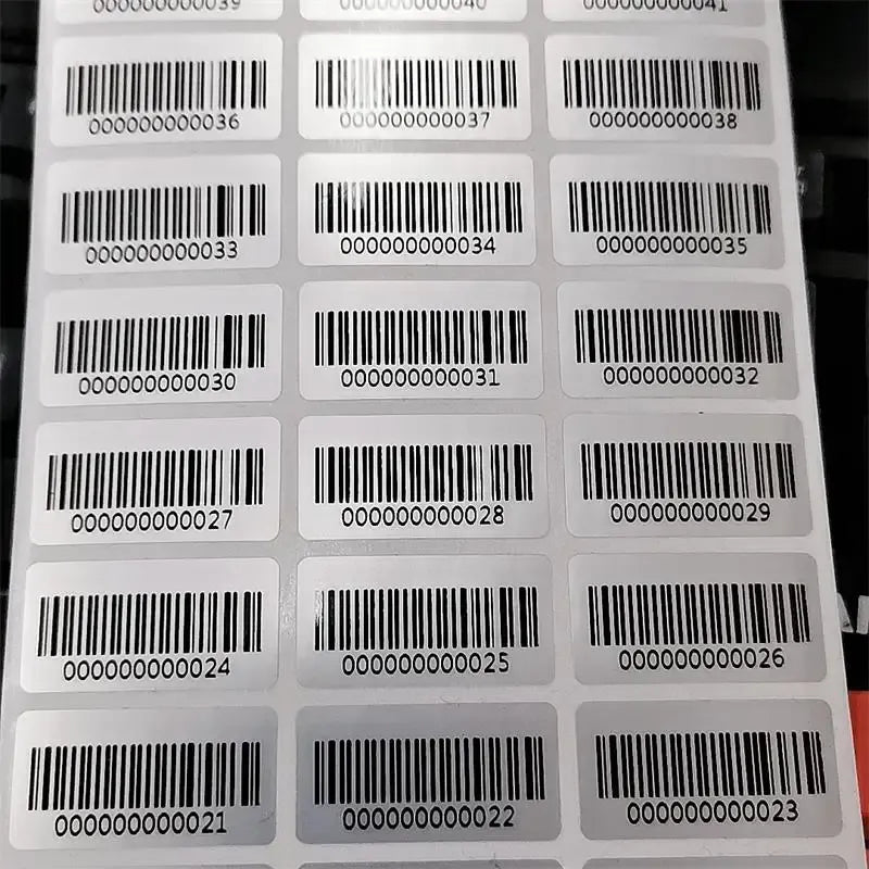Barcode inventory sticker labels on sheet, white with black bars and numbers