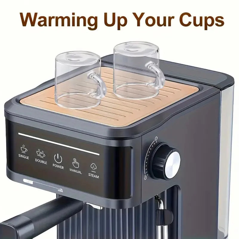 Black espresso machine with integrated cup warming tray, heating two clear glass mugs on top control panel.