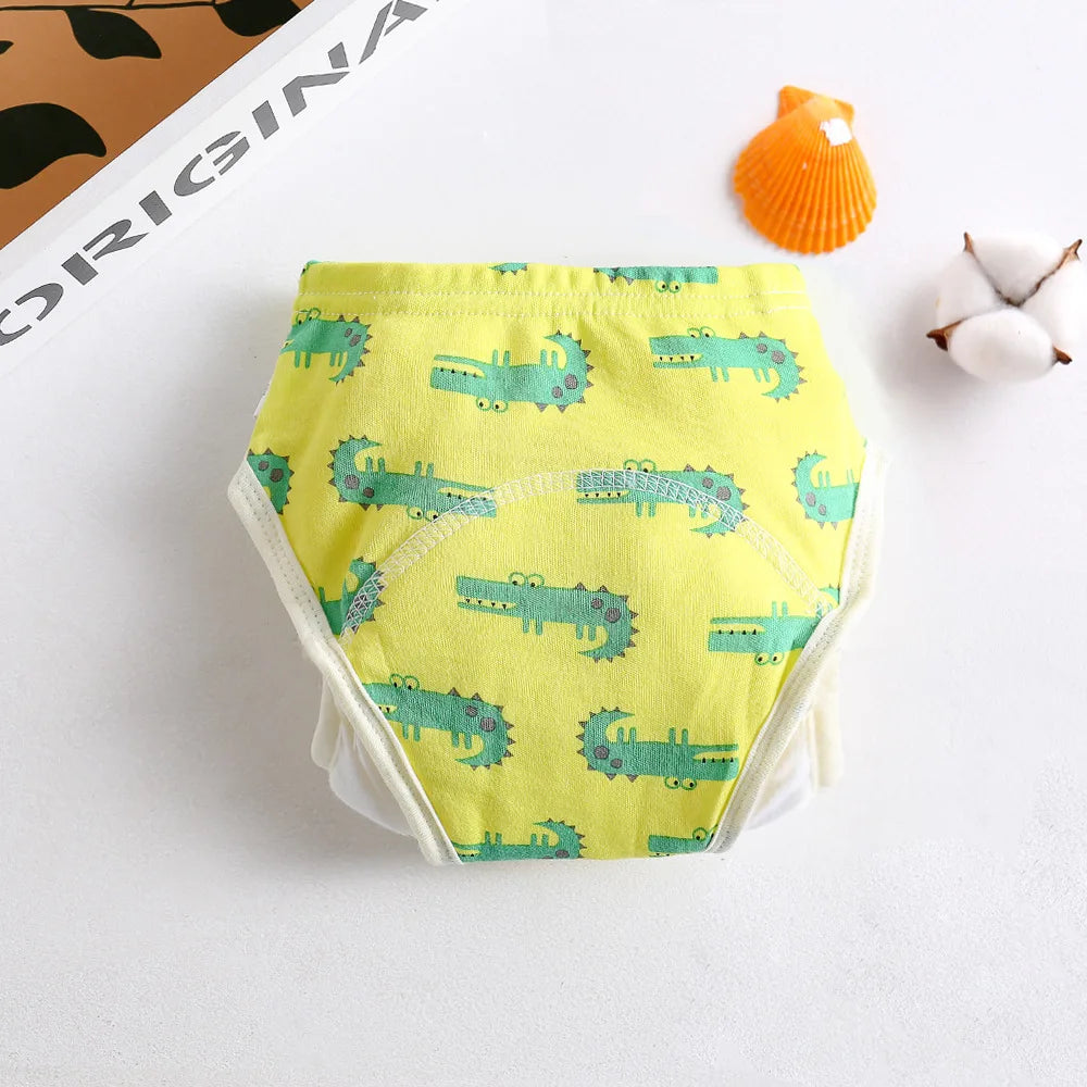 Reusable cotton baby training diaper featuring a yellow and green alligator print for toddlers.