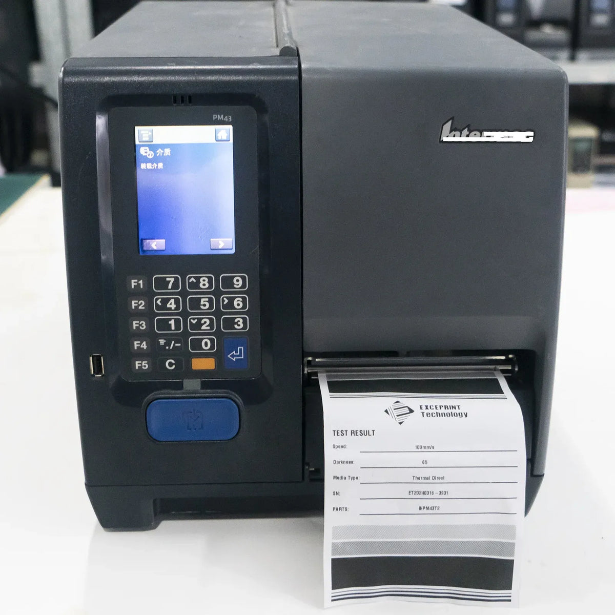 Intermec label printer with screen and thermal print output test strip