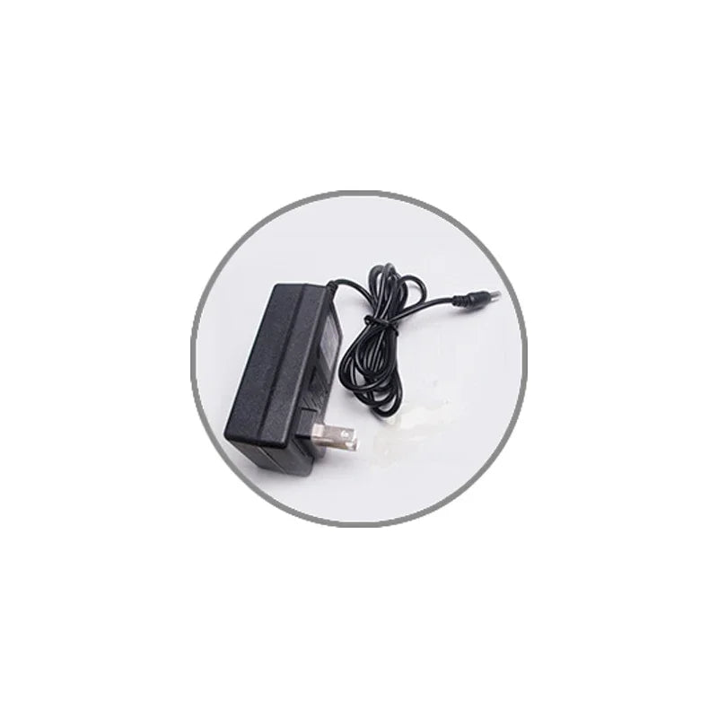 Black power adapter with a wall plug and a long thin charging cable.