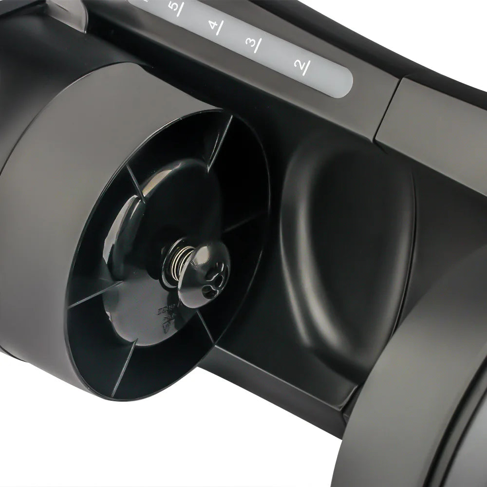 Black plastic coffee maker internal brewing chamber with cup size volume markings and spring-loaded center nozzle.