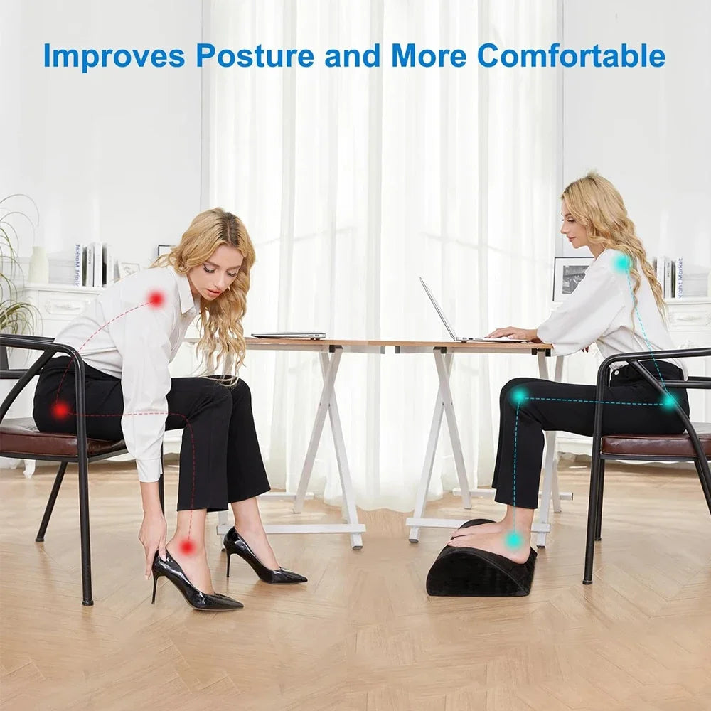 Black ergonomic memory foam under desk foot rest cushion for improved posture and comfort at work.