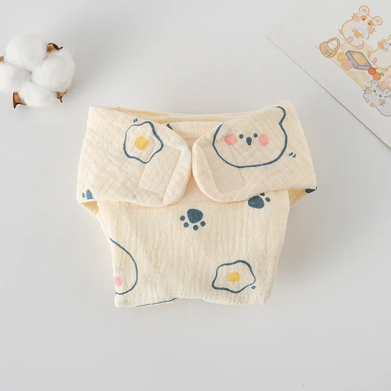 Soft cotton baby diaper cover in yellow with cute bear, paw print, and fried egg pattern for comfortable baby care.