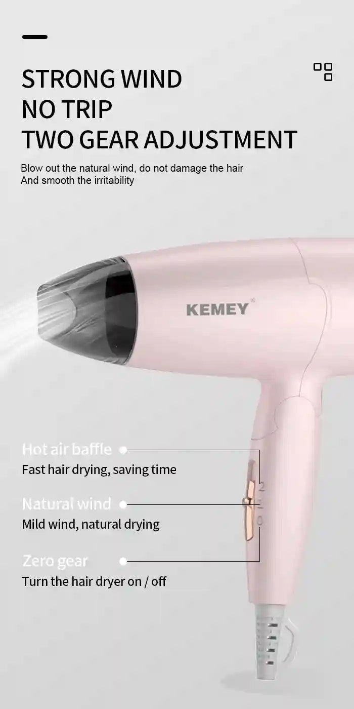 Kemei pink foldable compact travel hair dryer with 950W, nozzle attachment, and 2-speed settings for fast hair drying.
