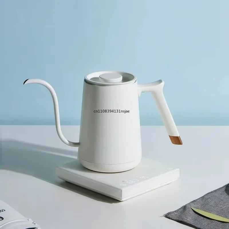 Modern white electric gooseneck kettle with gold accent handle on a digital base for precise pour-over coffee brewing.