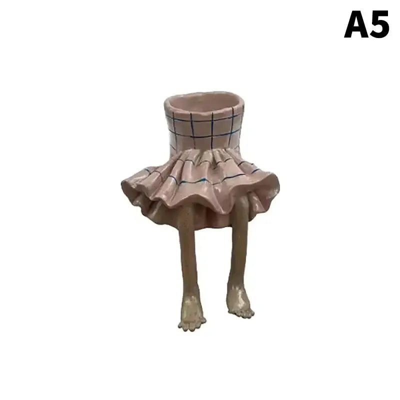 Beige-and-gray checkered leggy resin planter with ruffled skirt and standing legs