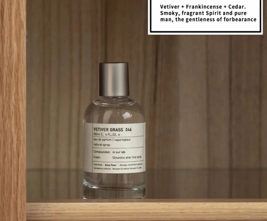 Alice Peter Vetiver Grass 100ml Unisex EDP. Round glass bottle, smoky vetiver, frankincense, and cedar fragrance notes.