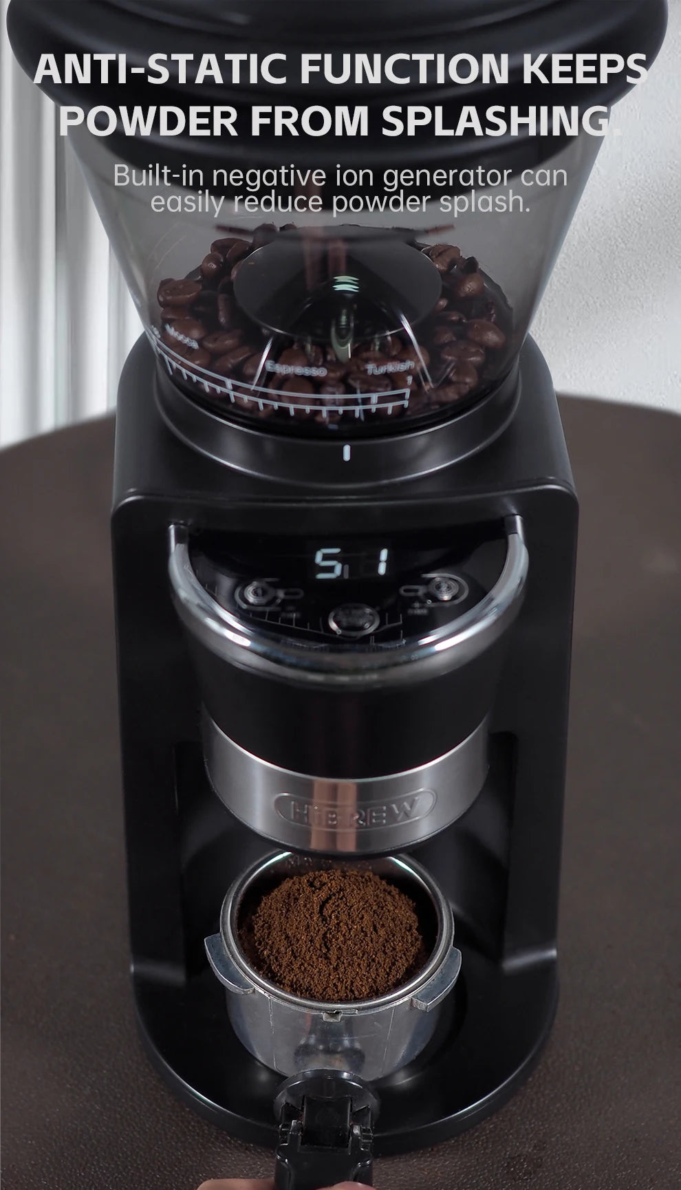 HiBREW black anti-static coffee grinder with bean hopper, digital display, and portafilter filled with coffee grounds.
