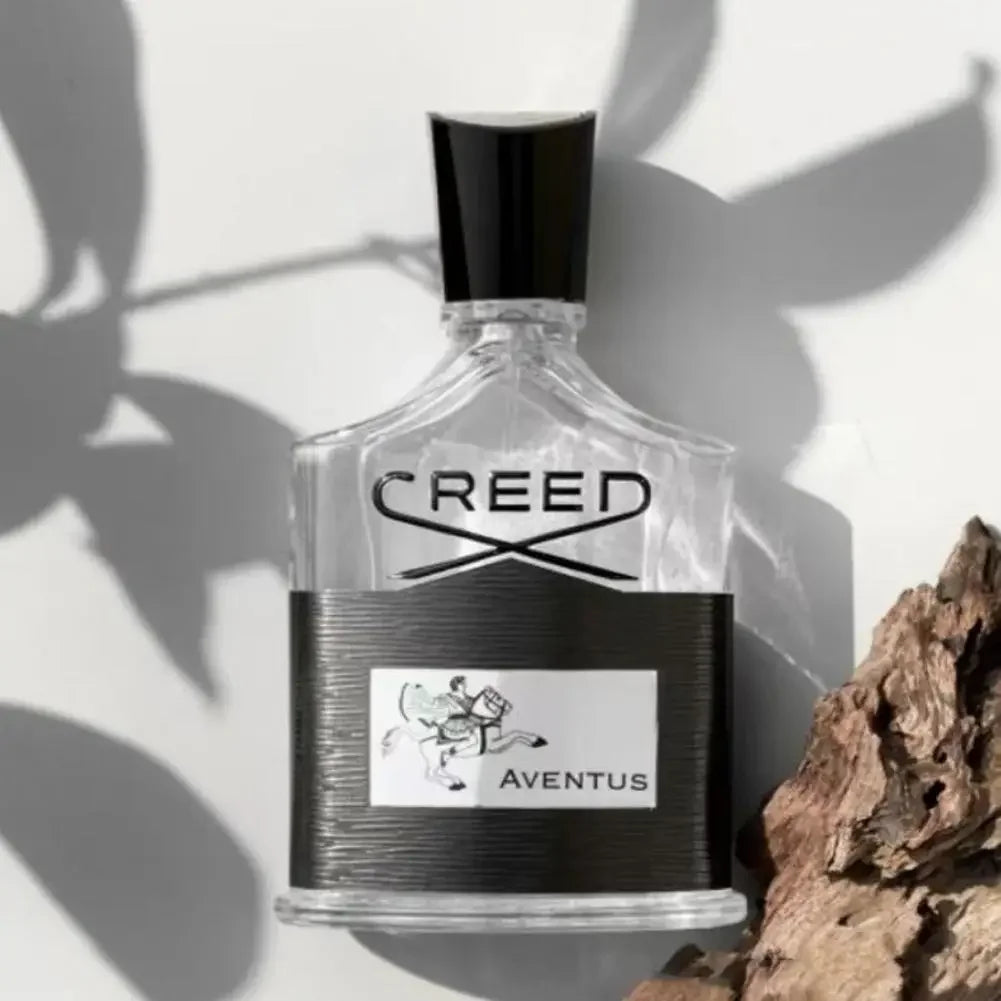 Creed Aventus Eau de Parfum: Unisex spray in signature glass bottle with black label and cap on white background.