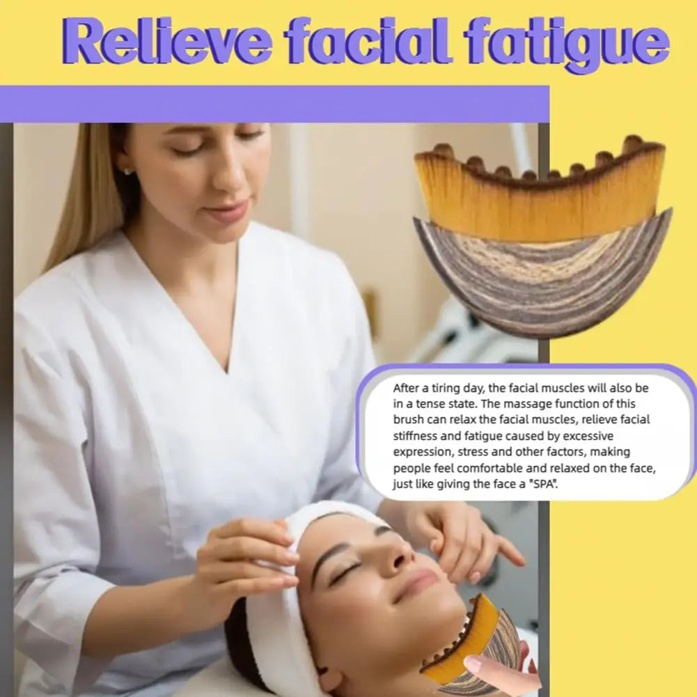 Curved facial brush with soft bristles and a wood-grain handle, used for lymphatic massage in a spa setting.