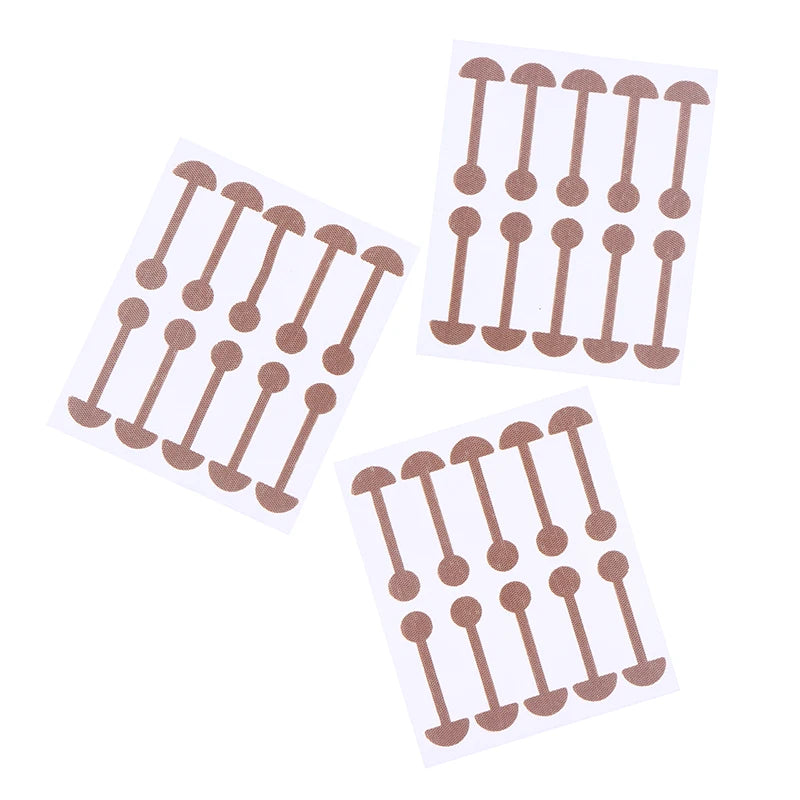 Invisible nose wing stickers on sheets, beige narrow nose lifting strips for face shaping and slimming aesthetics.