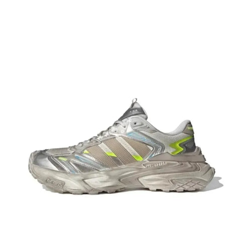Adidas Storm Edge dad sneakers in silver, brown, and white with shock-absorbing soles and neon green accents.