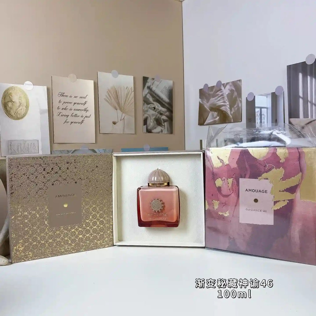 Amouage Guidance 46 100ml perfume in a square pink-to-red ombre glass bottle with a dome cap in a gold gift box.