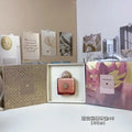 Amouage Guidance 46 100ml perfume in a square pink-to-red ombre glass bottle with a dome cap in a gold gift box.