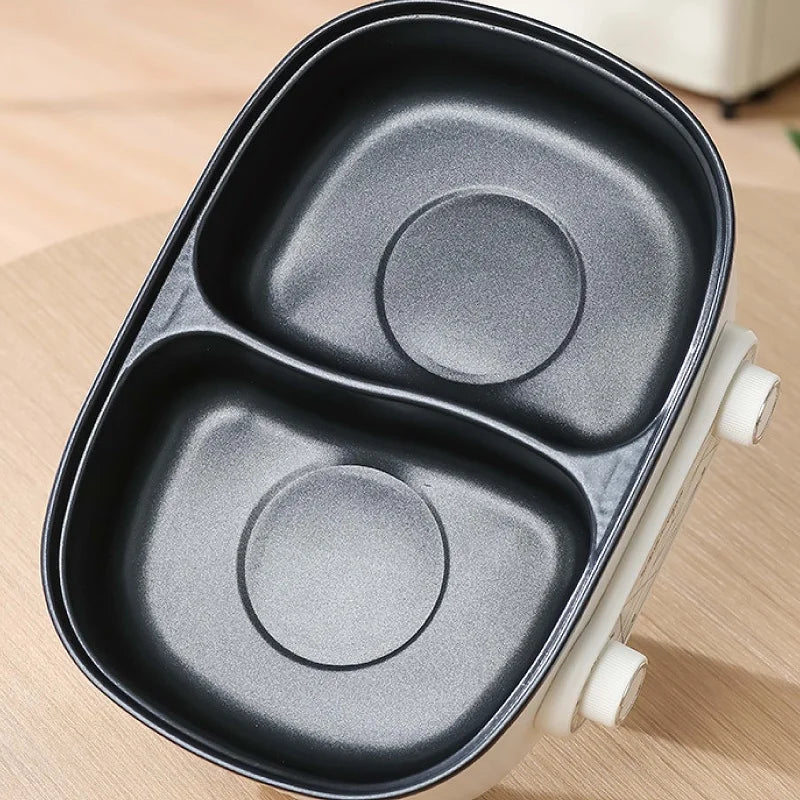Black non-stick double-liner insert with two round heating zones for electric hot pot