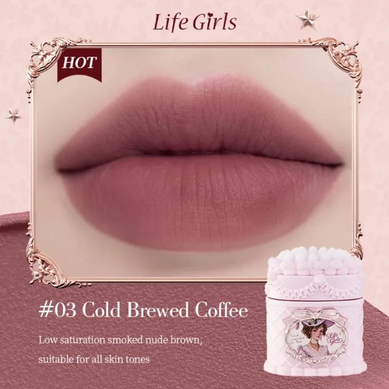 Matte velvet lip mud in Cold Brewed Coffee, a highly pigmented, soft-focus, smoked nude brown lipstick in vintage jar.
