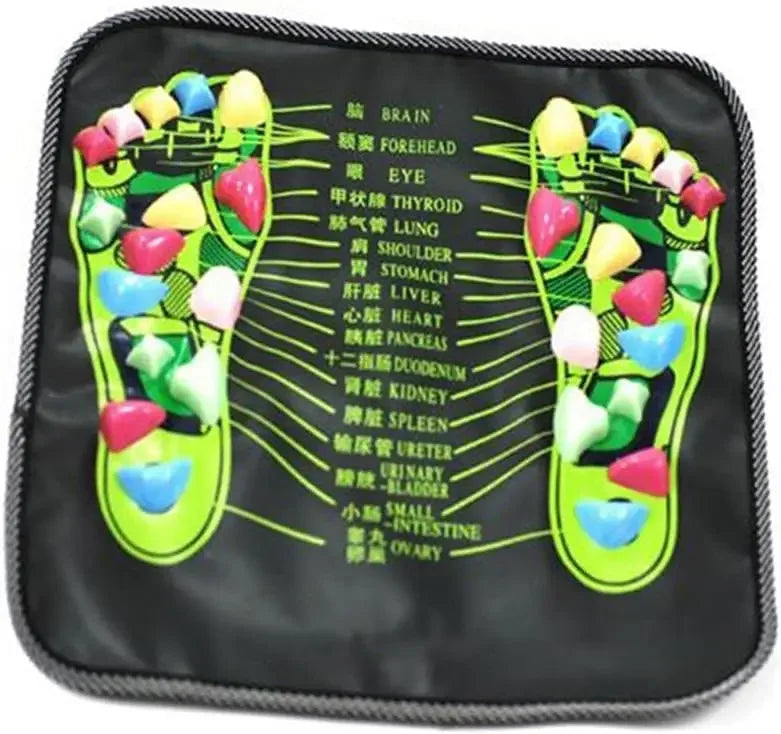 Black acupressure foot reflexology massage mat with colorful pressure stones and organ reflex point guide chart.