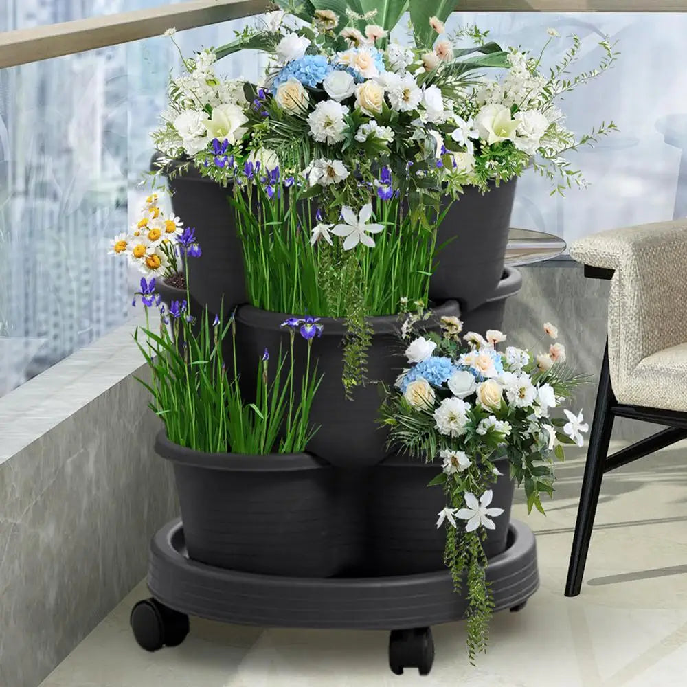 3-tier vertical planter tower in dark finish with blooming flowers and wheeled base