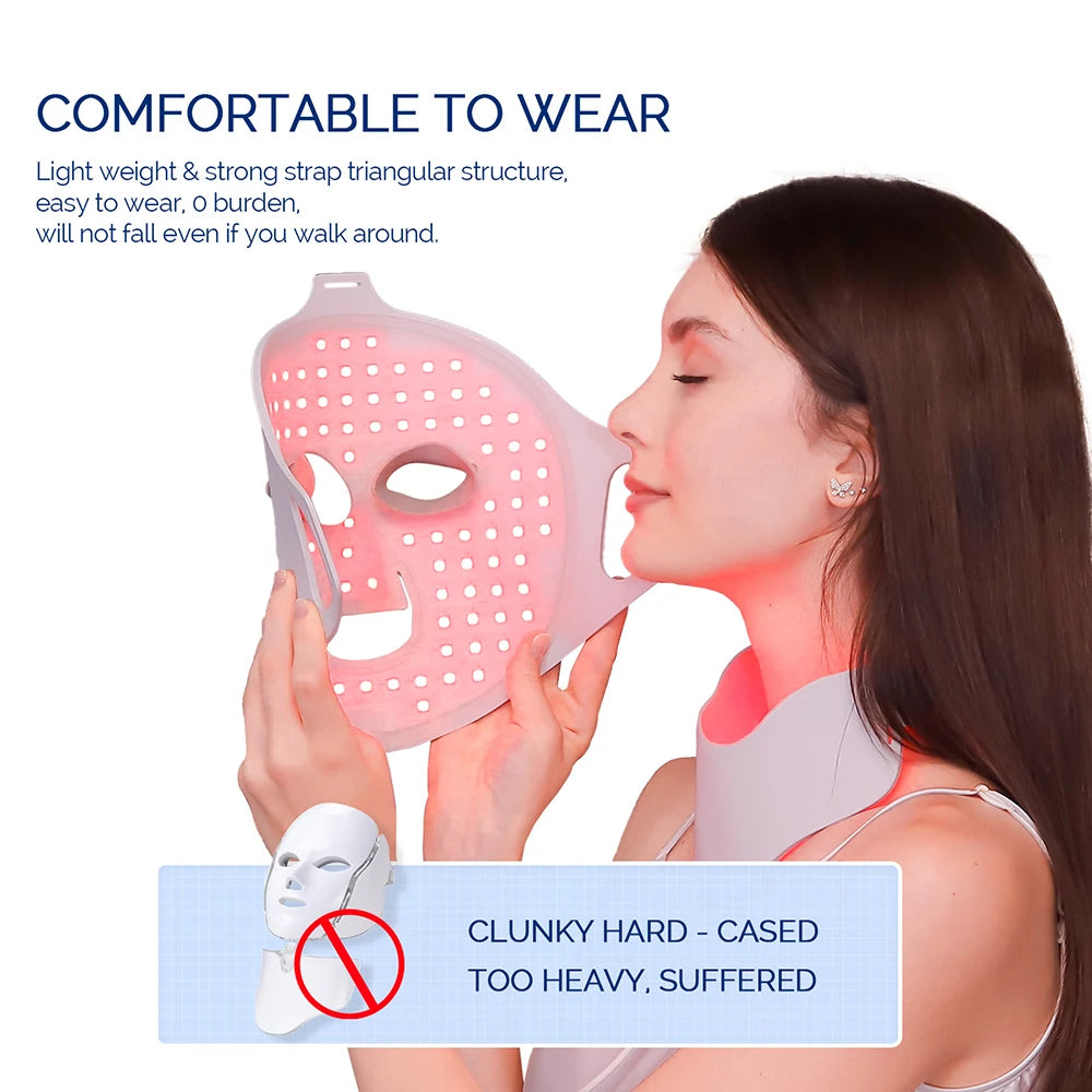 A woman wears a flexible, light-pink silicone LED face and neck mask glowing with red light therapy.