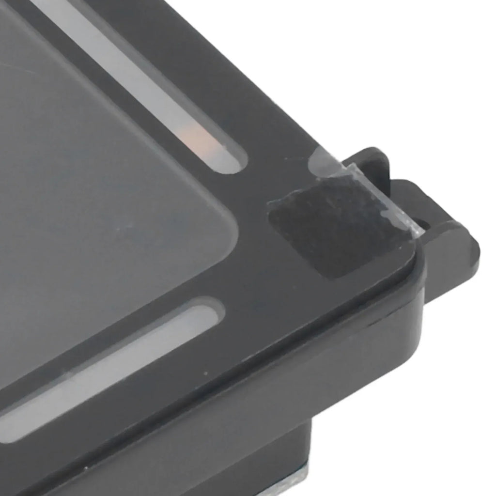 Close-up of black barcode reader module front housing and mounting edge