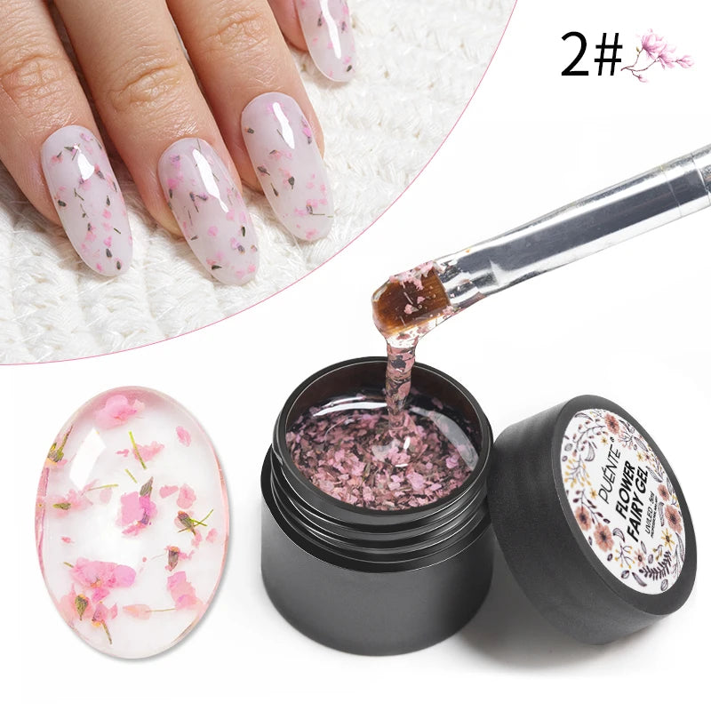 Flower Fairy Gel nail polish in a black jar, containing clear gel with pink dried flower petals for nail art.