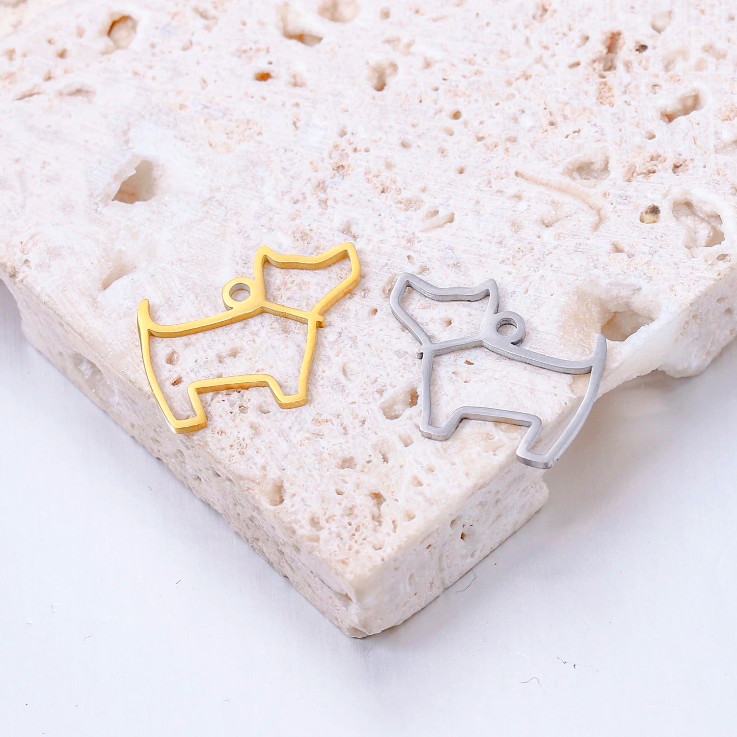 Gold and silver stainless steel balloon dog charms for DIY jewelry making, necklaces, and bracelets.