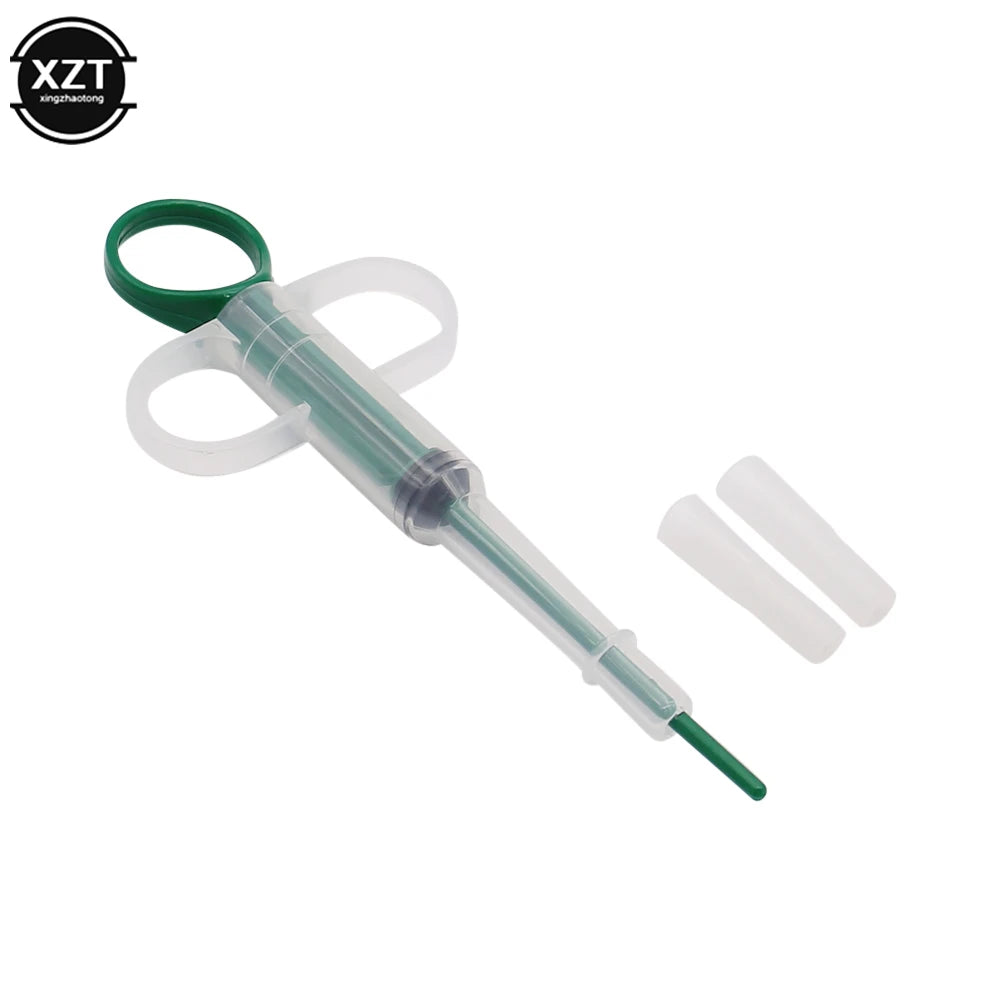 Green plastic pet pill dispenser syringe for easy medicine, tablet, or water feeding for cats and dogs.