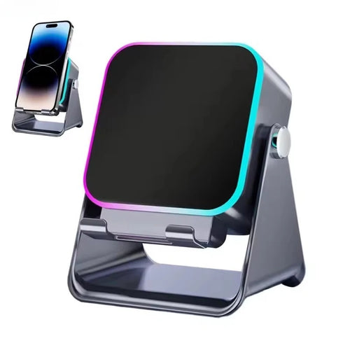 Black portable Bluetooth speaker with phone holder base and glowing RGB edge light